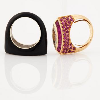 A ruby, diamond and black enamel ring.