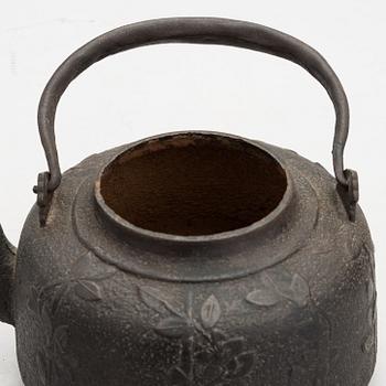 Two teapots and a hibachi brazier, Japan, early/ first half of the 20th century.