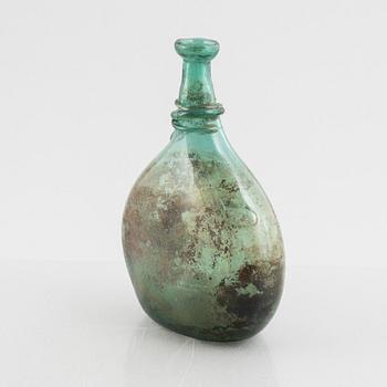 A turquoise tinted glass bottle, 19th century.