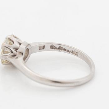 A platinum ring set with an old-cut diamond, by Wiwen Nilsson.