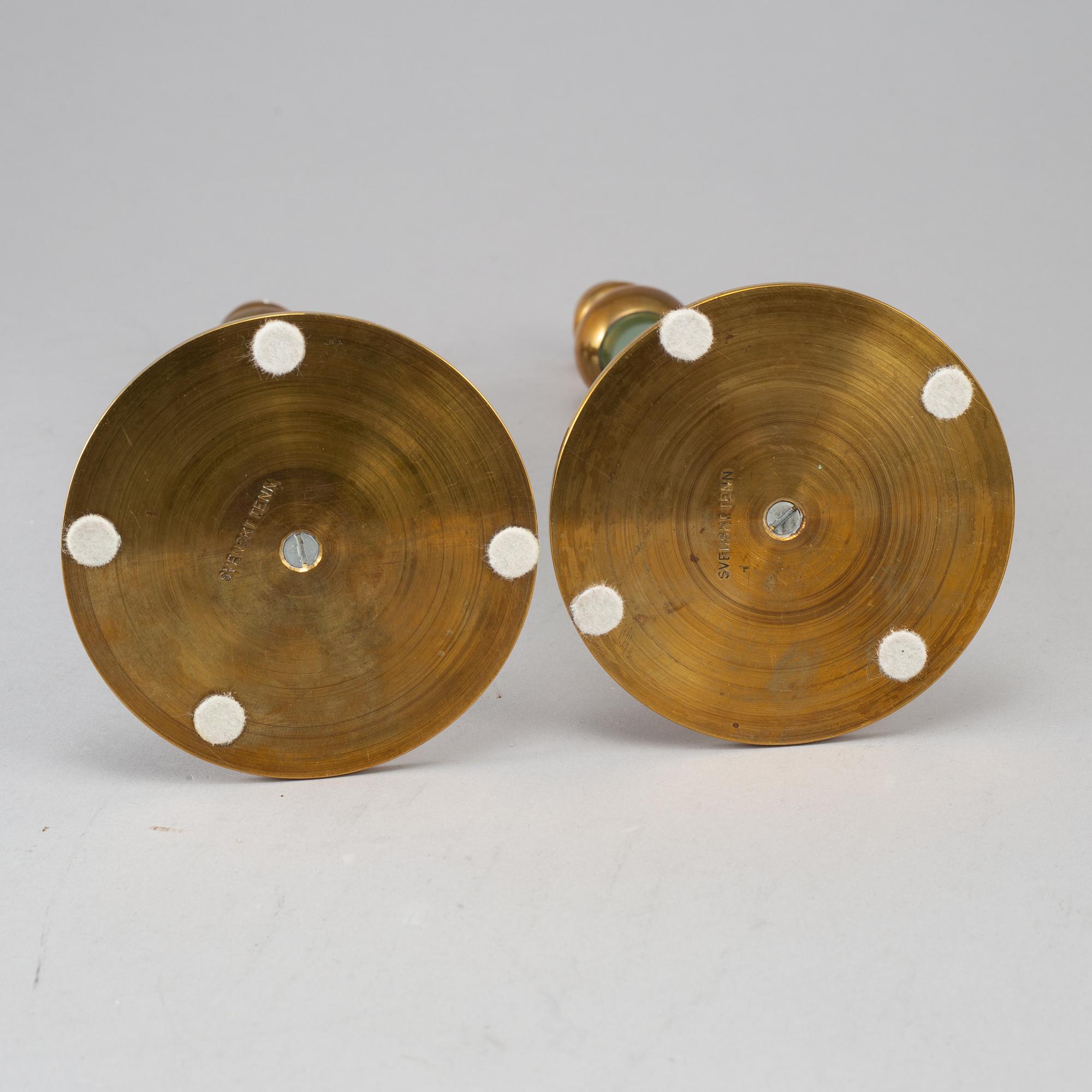 FIRMA SVENSKT TENN, a pair of Swedish 20th century  brass candlesticks marked Svenskt Tenn.