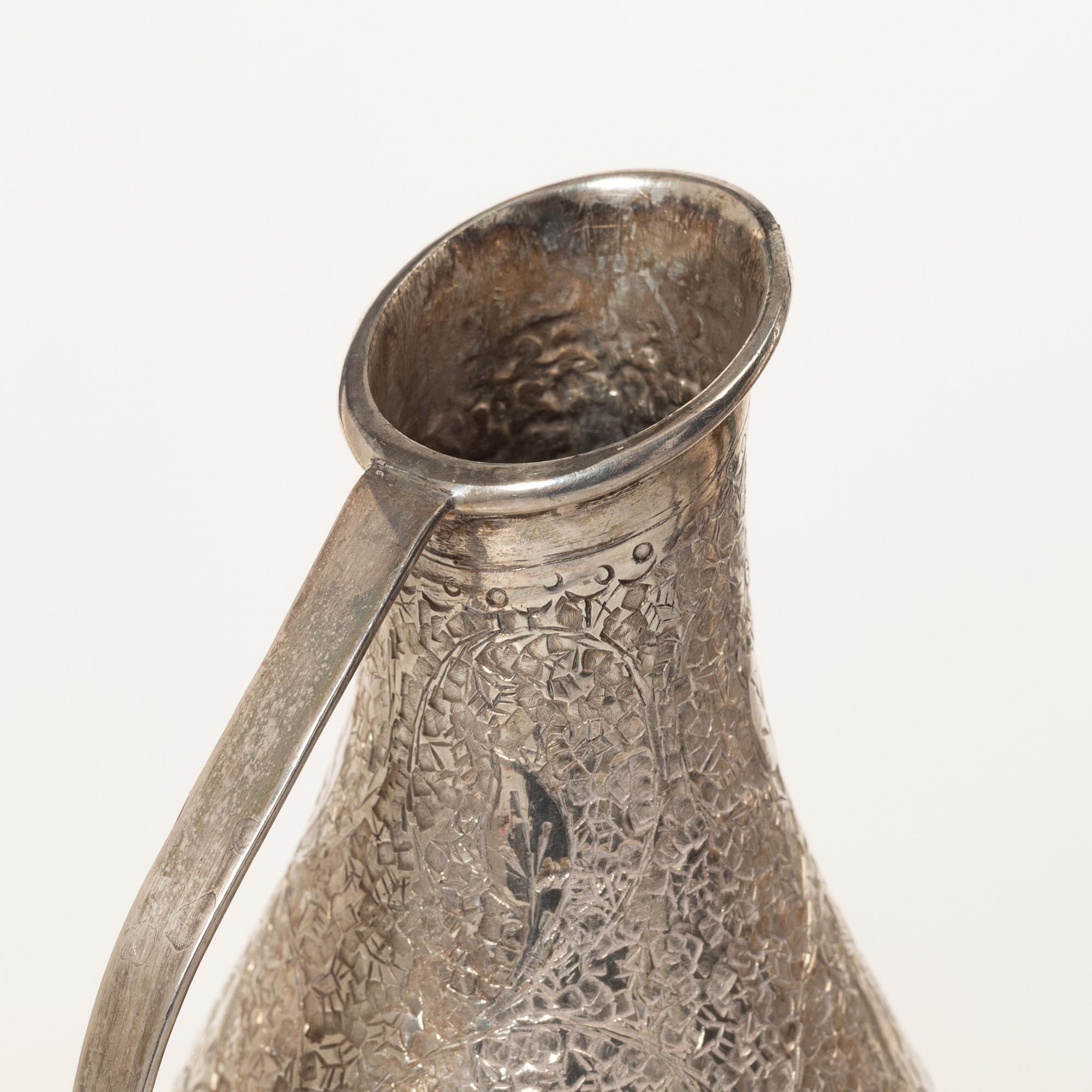 A pair of jugs, silver, Pakistan, mid-20th century.
