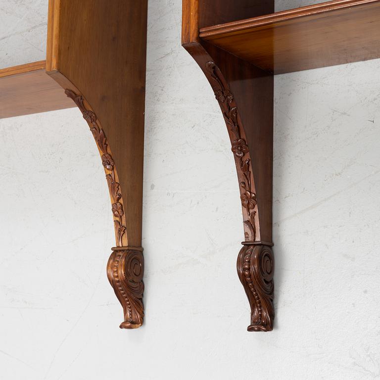 A pair of mahogany wall bookshelves, around 1900.