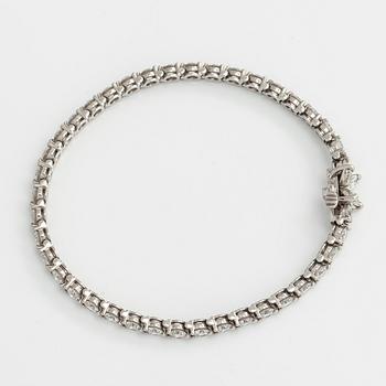 Tiffany & Co, "Victoria" tennisrannekoru, platinaa sekä briljantti- ja marquisehiottuja timantteja.