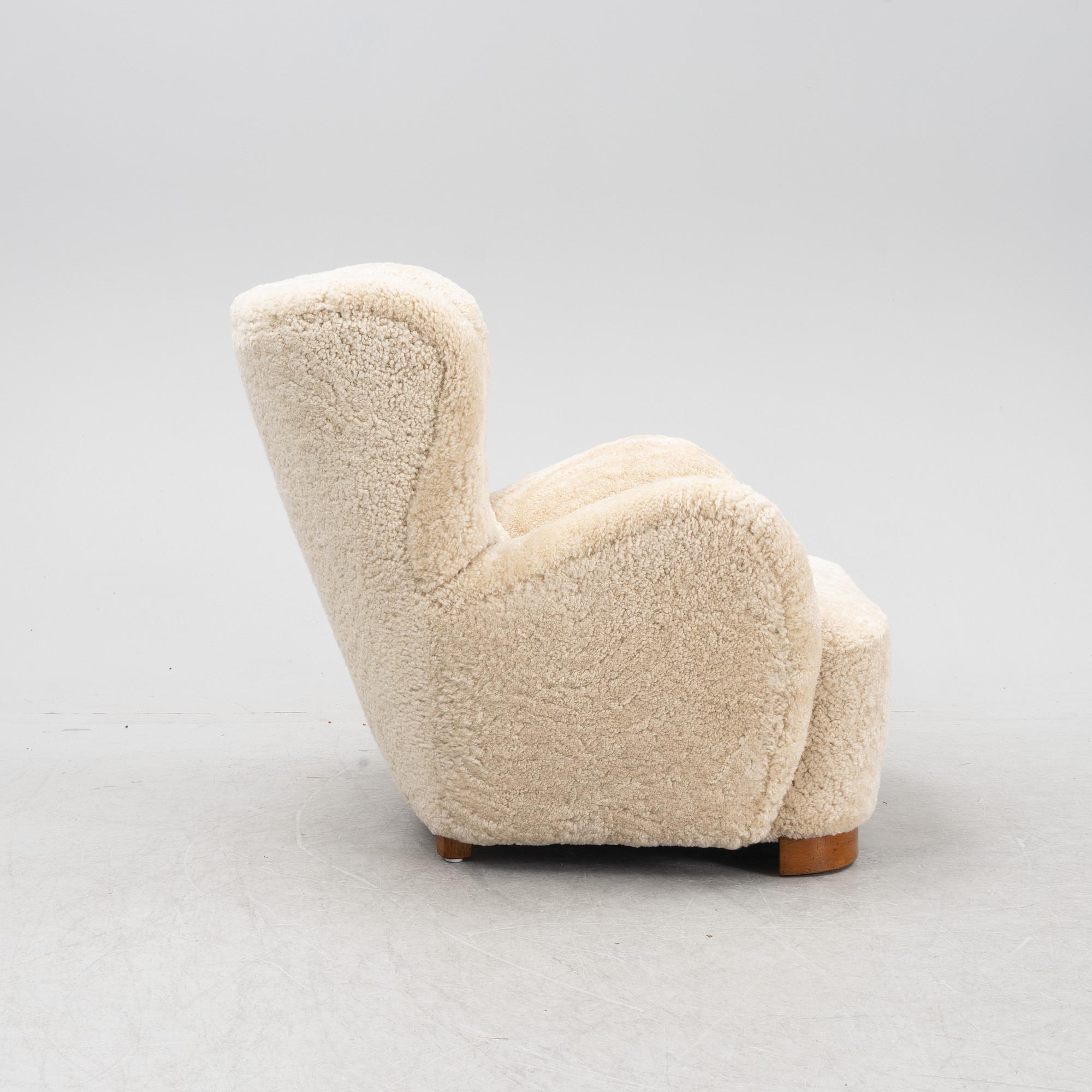 A lounge chair with new sheepskin upholstery, Denmark, 1940's.