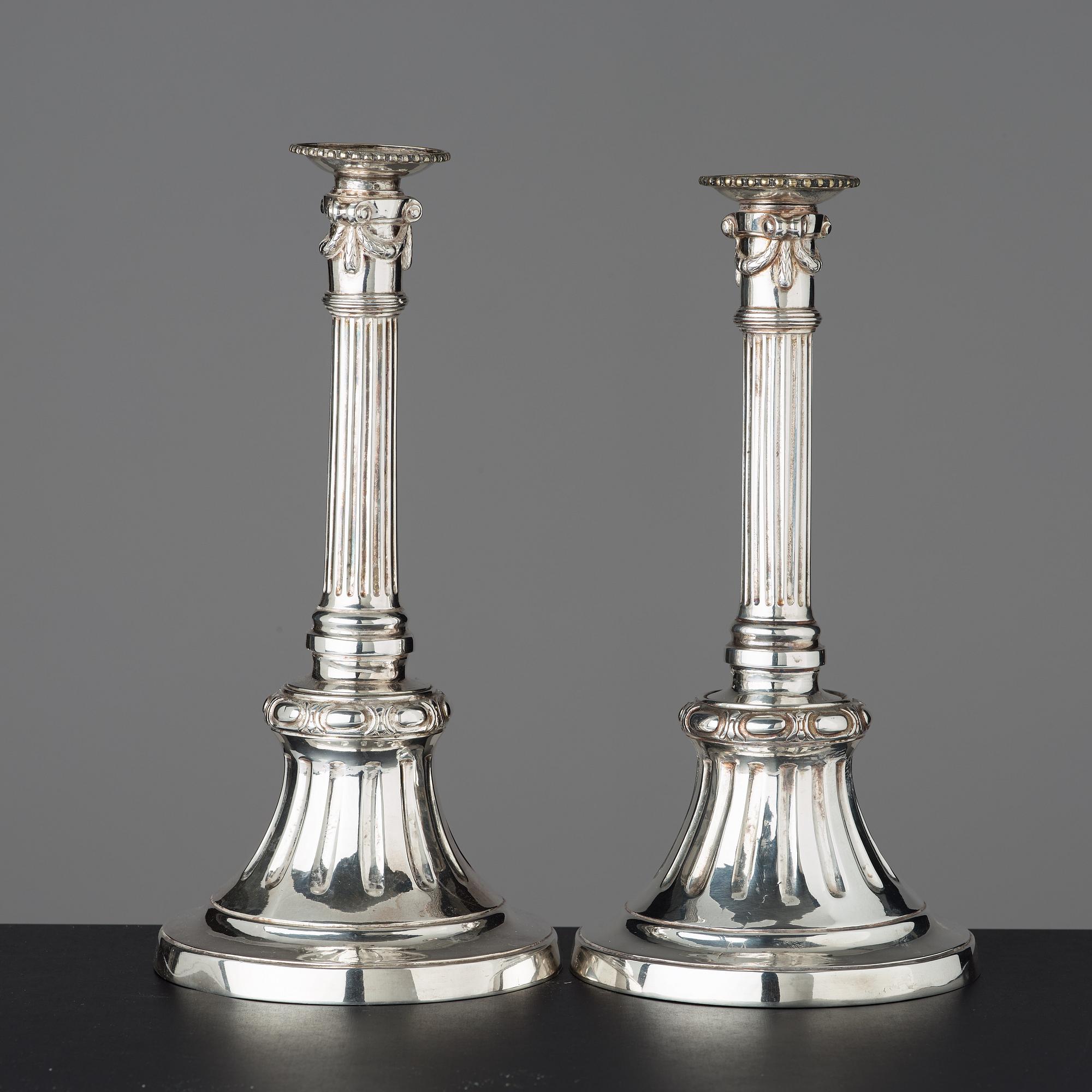 Two similar Gustavian late 18th century candlesticks.