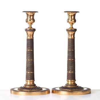 A pair of French Empire early 19th century candlesticks.