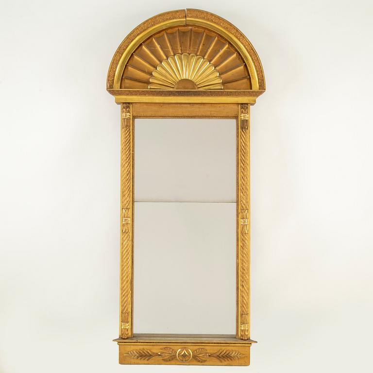 An Empire mirror from the first half of the 19th century.