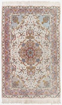 A Tabriz carpet north west Persia, part silk, c. 314 x 197 cm.