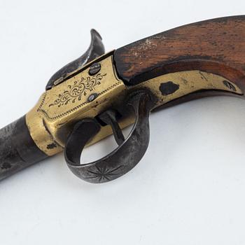 A 19th Century percussion pistol.