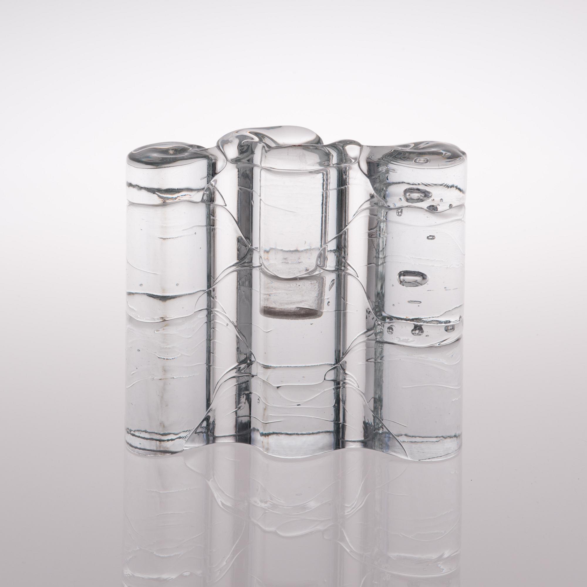 A glass sculpture / a set of three candlesticks, the Archipelago series. Signed Timo Sarpaneva.