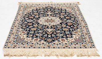 A Nain rug, part silk, c. 128 x 82 cm.