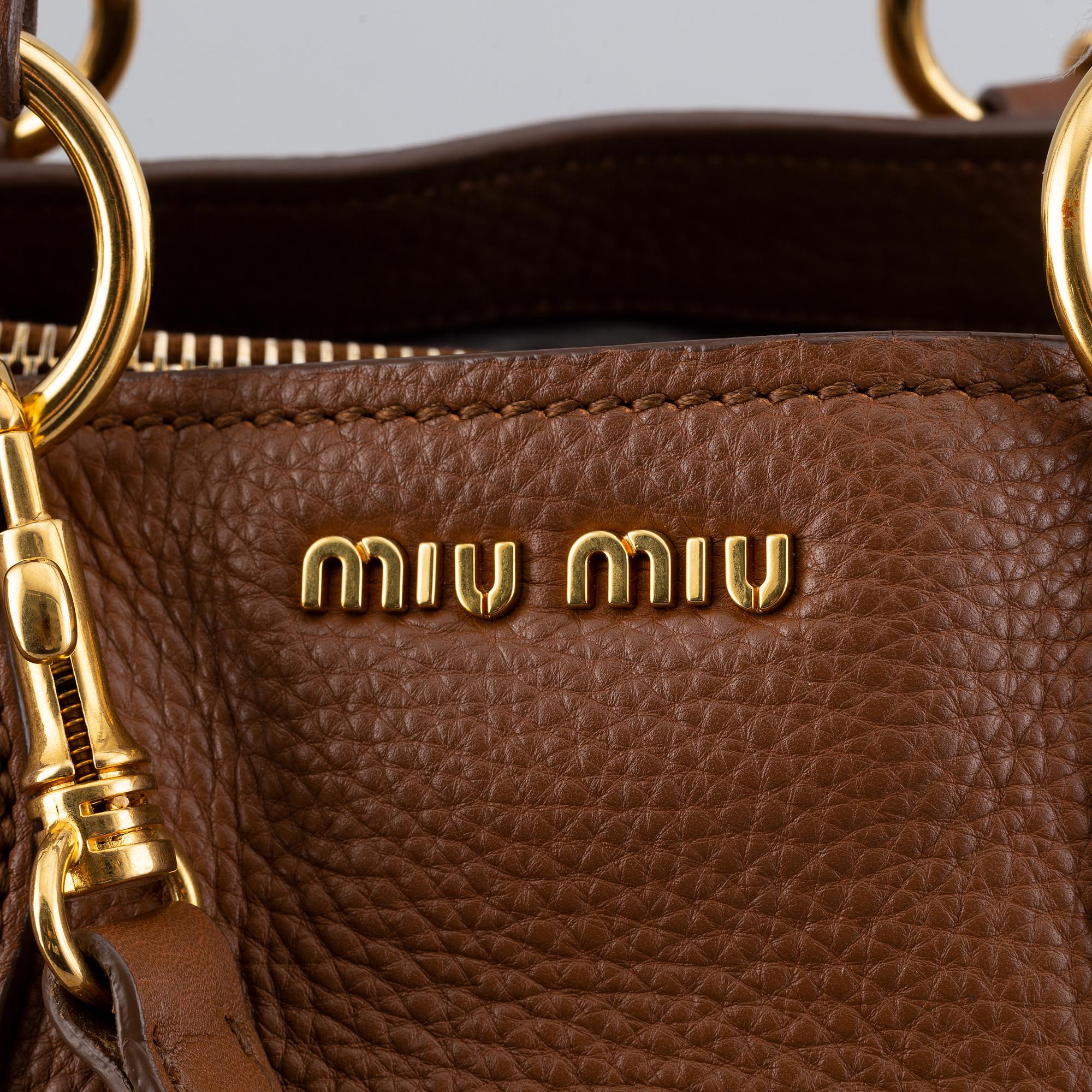 Miu Miu, a leather bag.