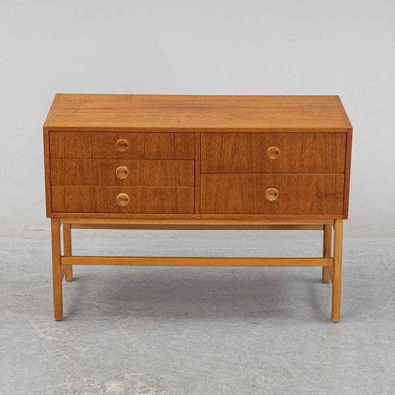 A 1950's/60's teak veneered chest of drawers.
