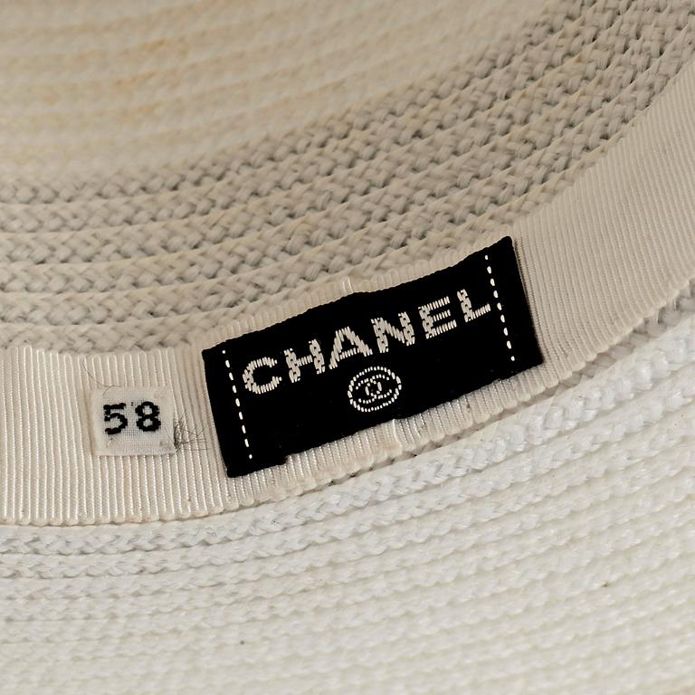 CHANEL, a white straw hat.