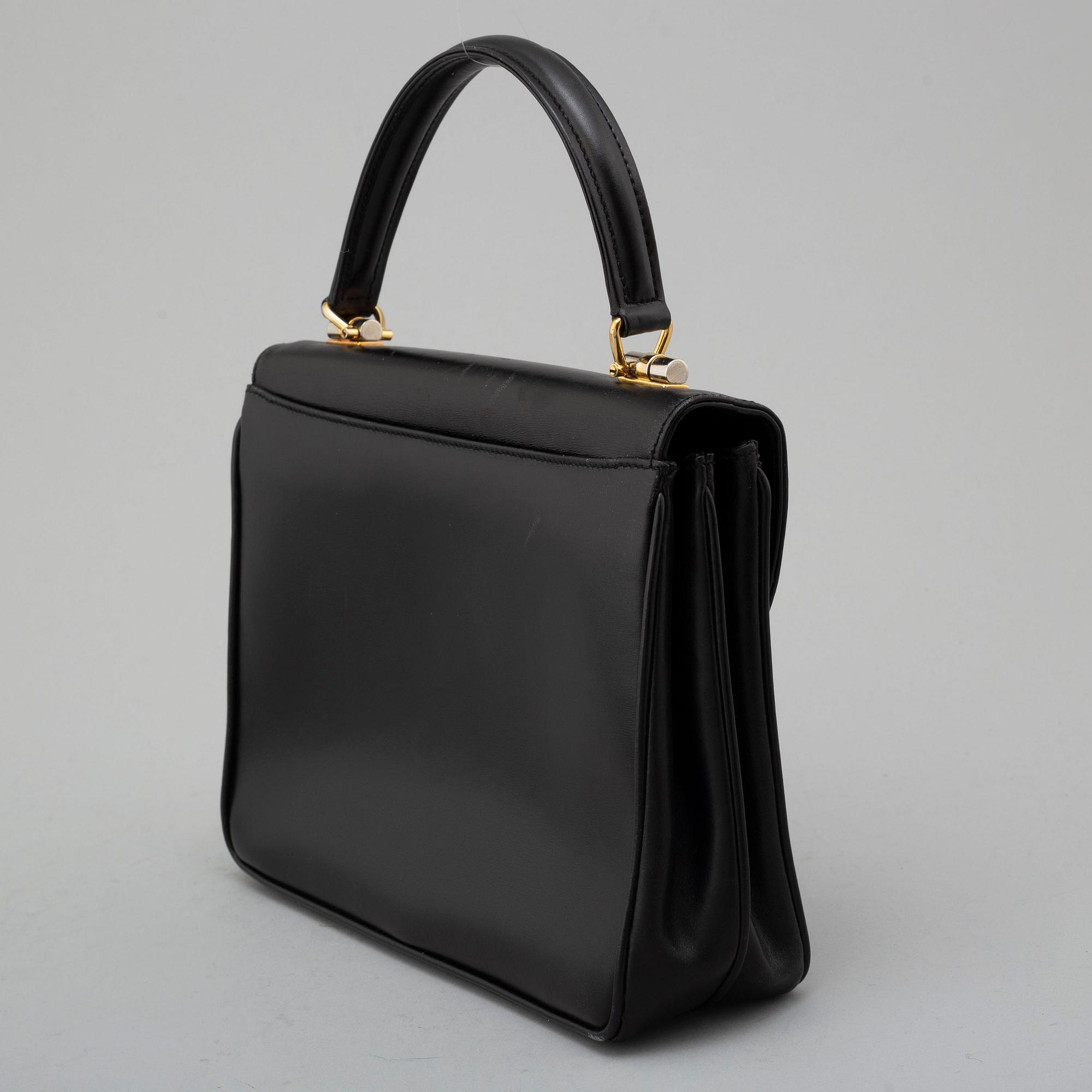 GUCCI, black leather bag.
