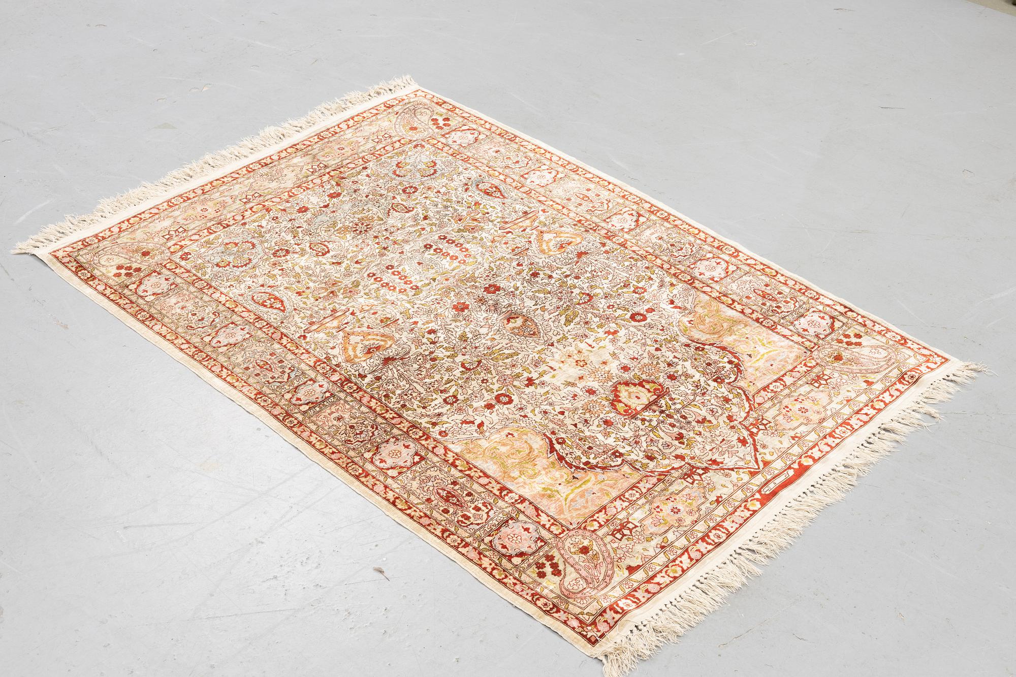 A rug, Old silk Hereke, ca 152 x 110 cm.