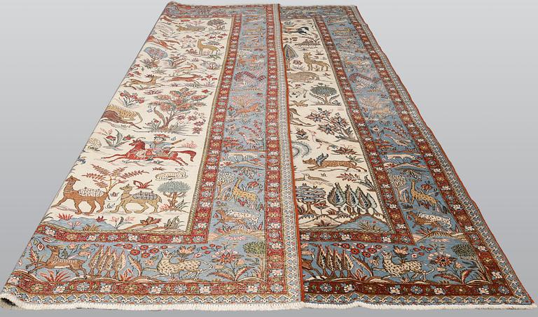 A semi-antique Ghom carpet, approx. 390 x 290 cm.