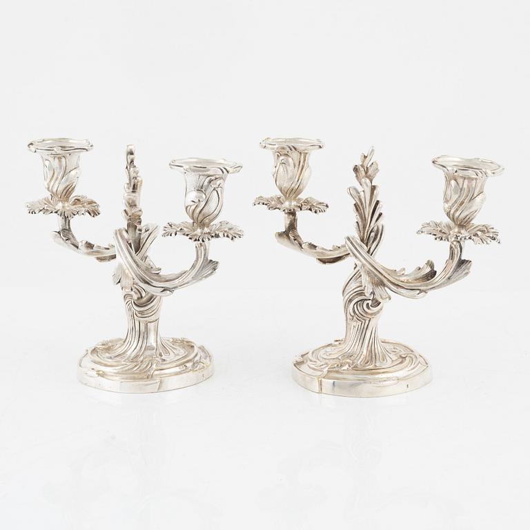 A rococo style pair of silverplated candelabras, end of the 19th Century..