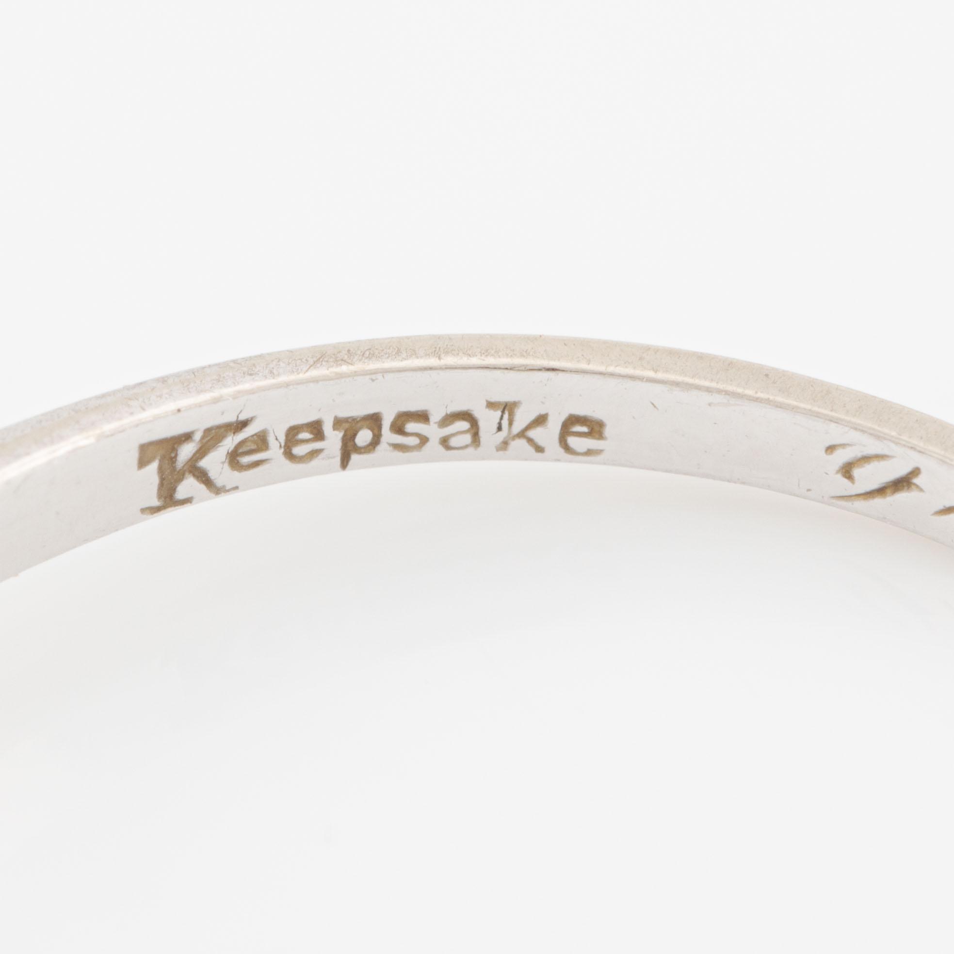 Ring 14K white gold with diamonds.
