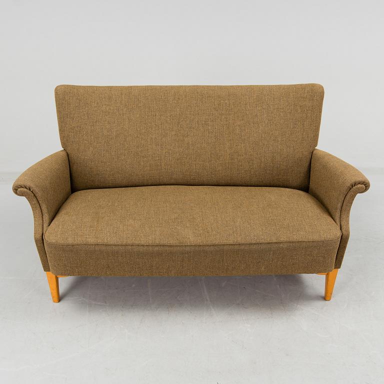 A 1940s  Dux sofa.