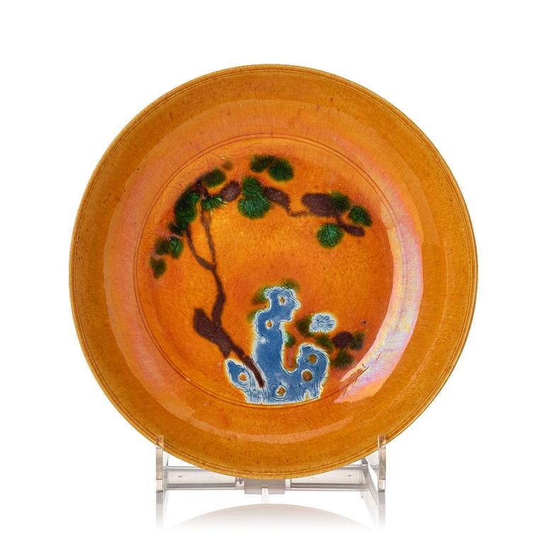 A yellow glazed dish, Qing dynasty, circa 1700.