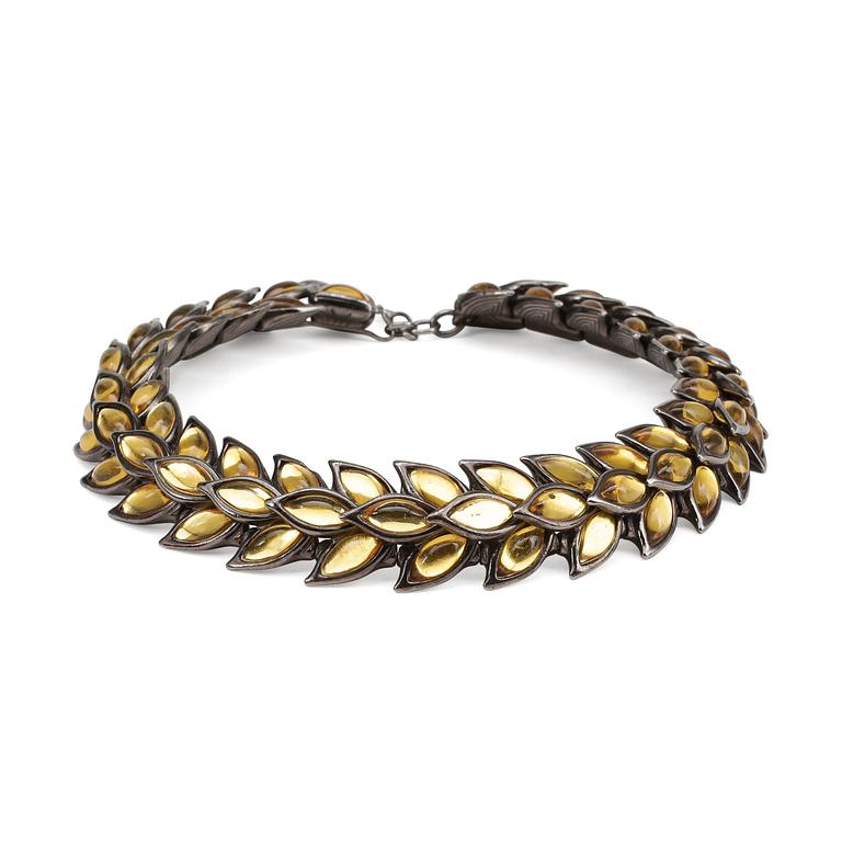 YVES SAINT LAURENT, a metal and glass necklace.