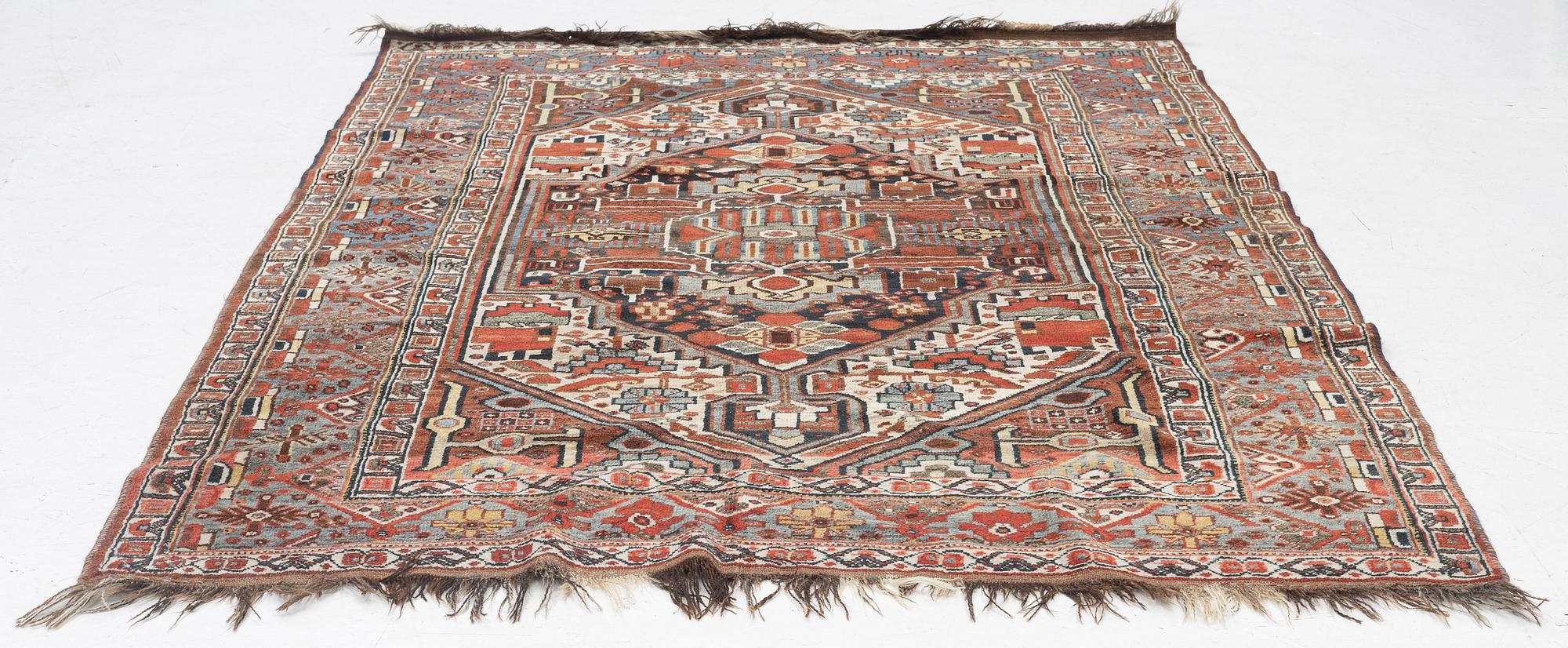 An antique Qashqai rug, southeastern Iran, c. 242 x 170 cm.