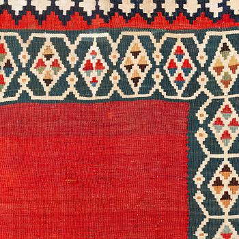 An antique Qashqai kilim rug, approximately 240 x 155 cm.