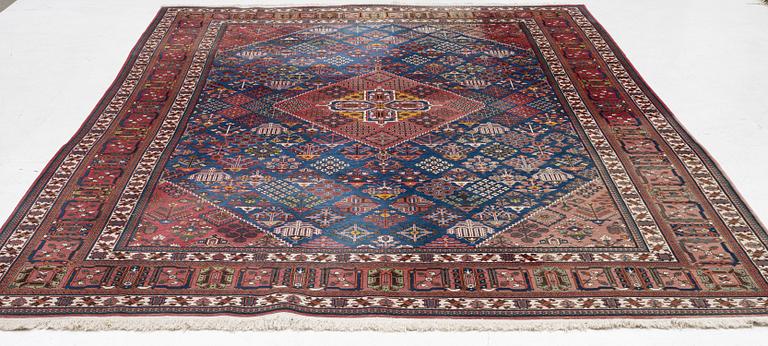 An oriental carpet, c. 360 x 240 cm.