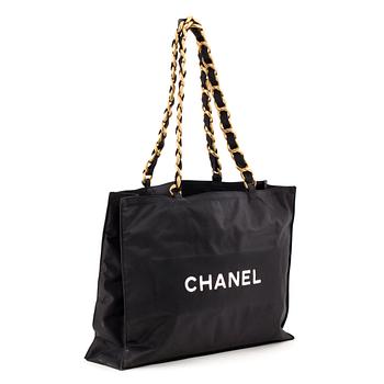 596. Chanel, CHANEL, a black nylon bag.
