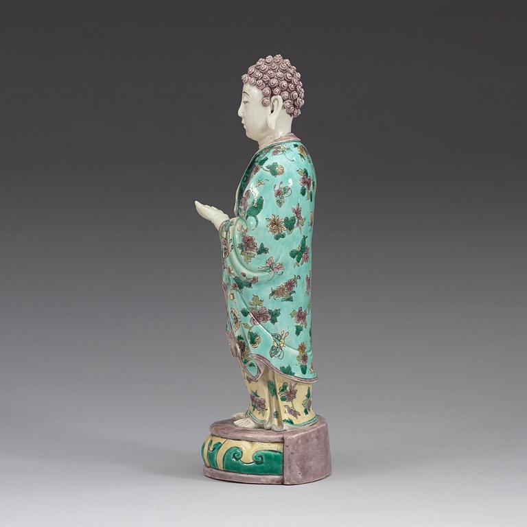 A famille verte figure of a standing Buddha, Qing dynasty, 19th Century.