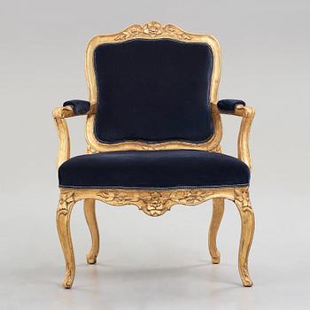 A Rococo mid 18th century armchair.