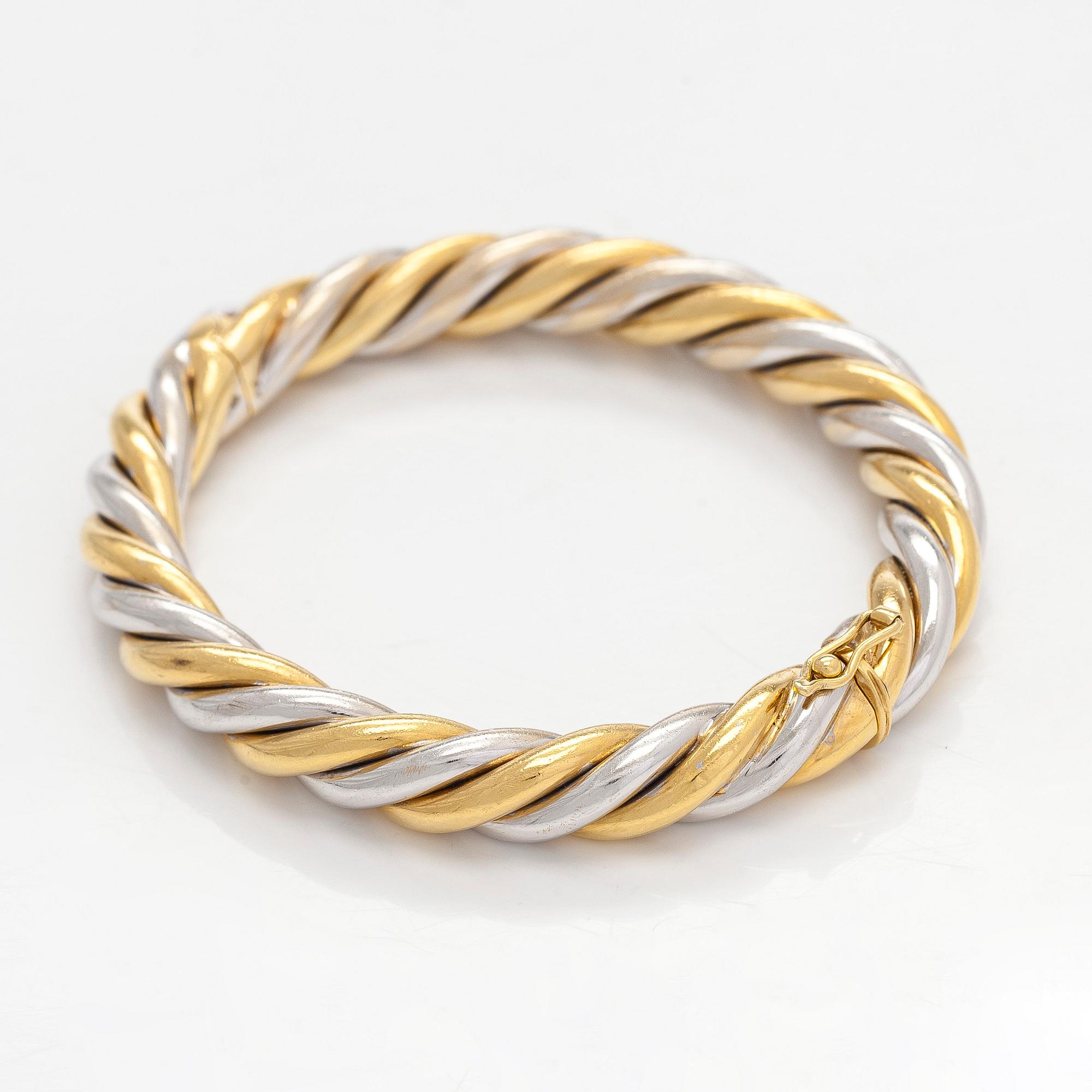 An 18K gold/white gold bracelet, Switzerland.