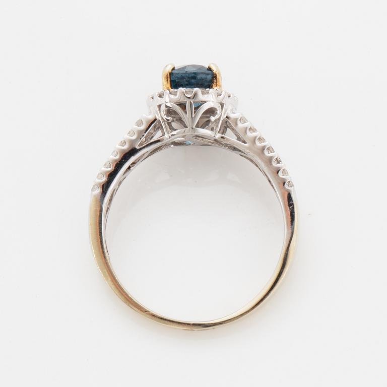 Oval faceted kyanite and diamond ring.
