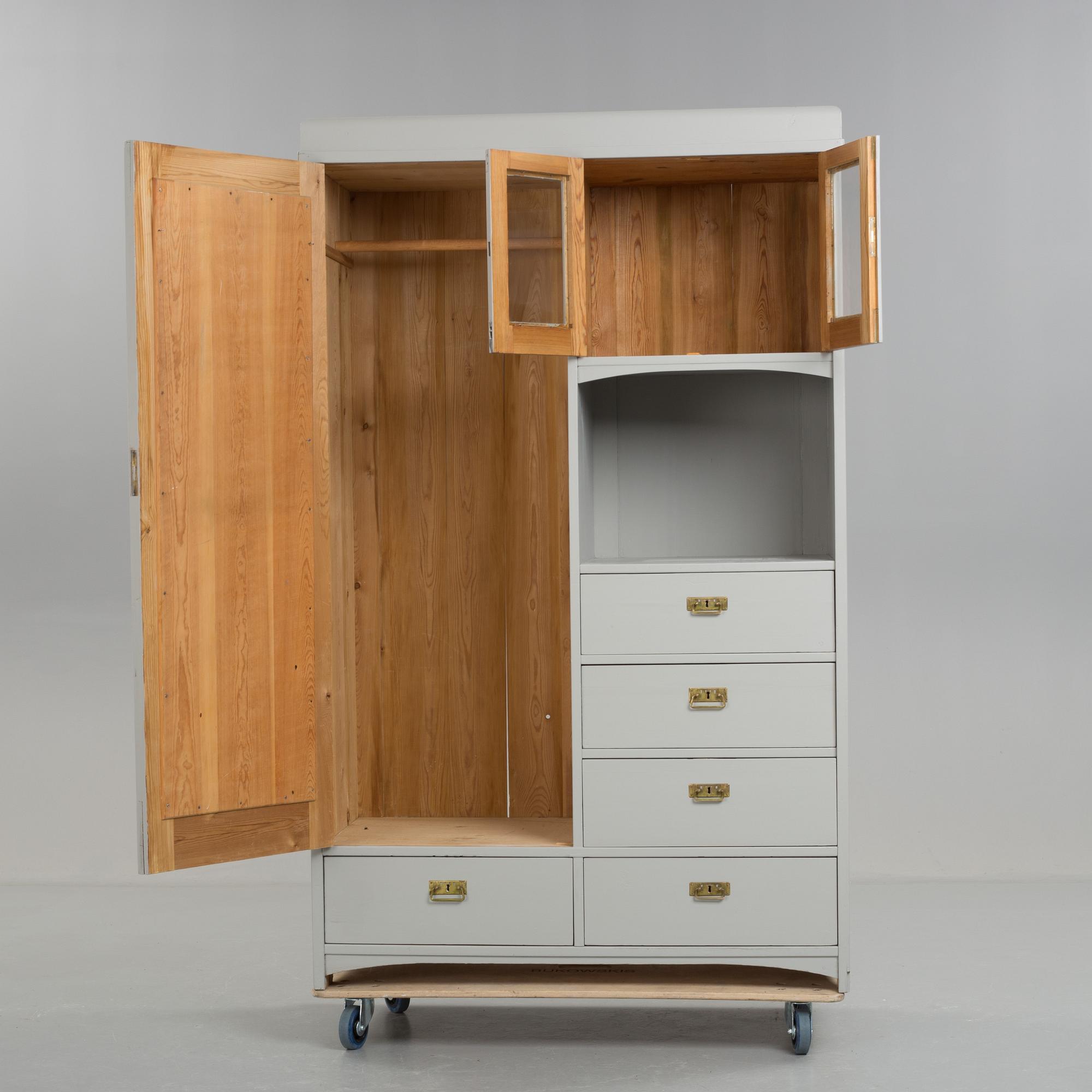 A early 20th century cabinet with mirror.