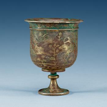 1835. A silver stem cup with hunting scenes, presumably Tang dynasty.