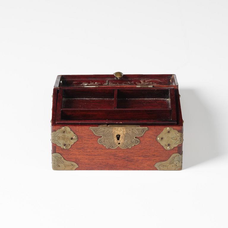 A Hongmu chest with brass mounts, late Qing dynasty.
