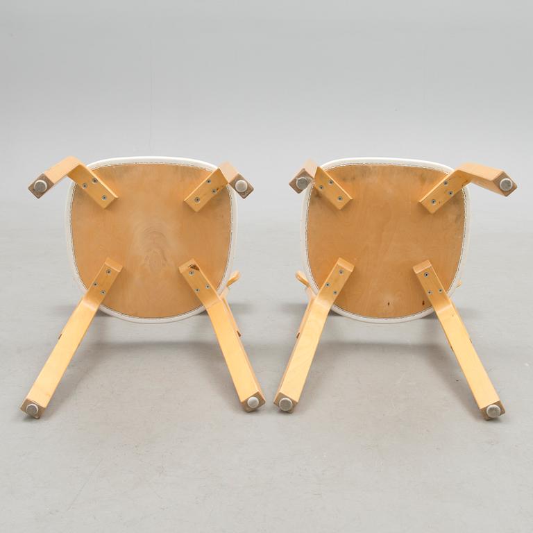 A pair of chairs model 69, Artek, late 20th Century. Design year 1935.