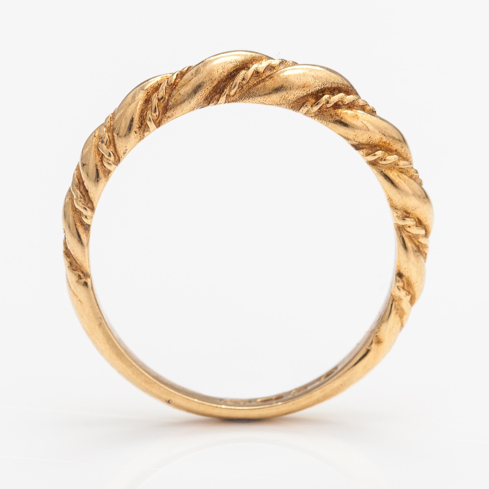 An 18K gold ring "Twined jewellery from Lampola in Halikko". Kalevala koru, Helsinki 1978.