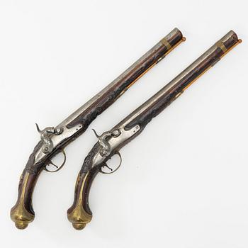 A pair of percussion pistols, converted from flintlock. 18th century.