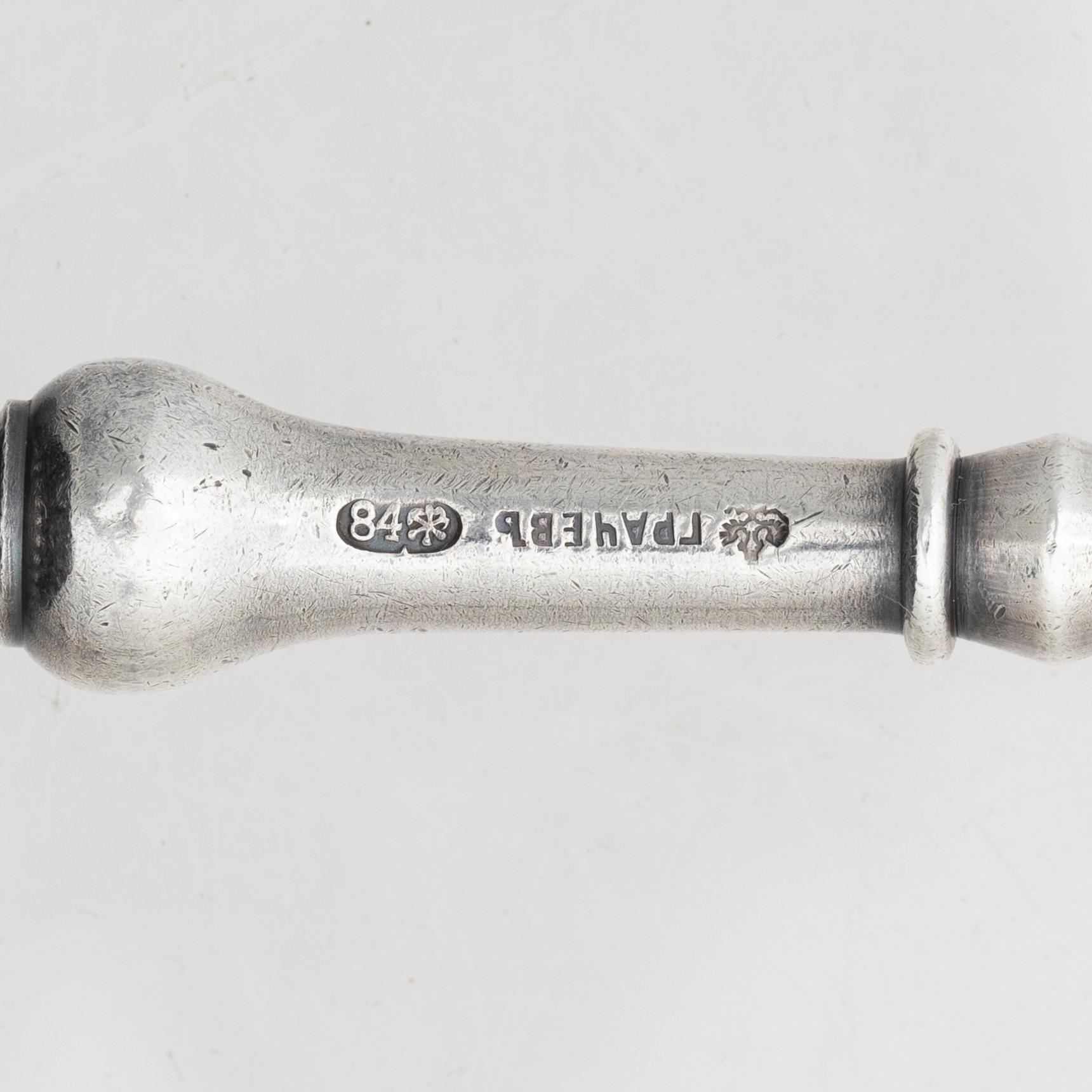 A silver server and six spoons, marks of Grachev, St Petersburg, and Helsingfors Juvel- och Filigranab, respectively.