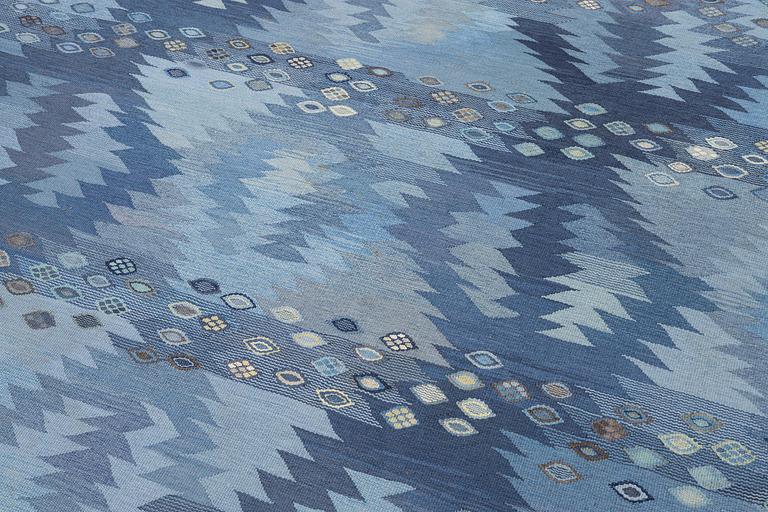 Barbro Nilsson, a carpet, 'Tånga mellanblå', flat weave, c. 350 x 252 cm, signed AB MMF BN.