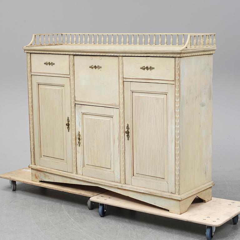 An early 19th Century painted late Gustavian cupboard.