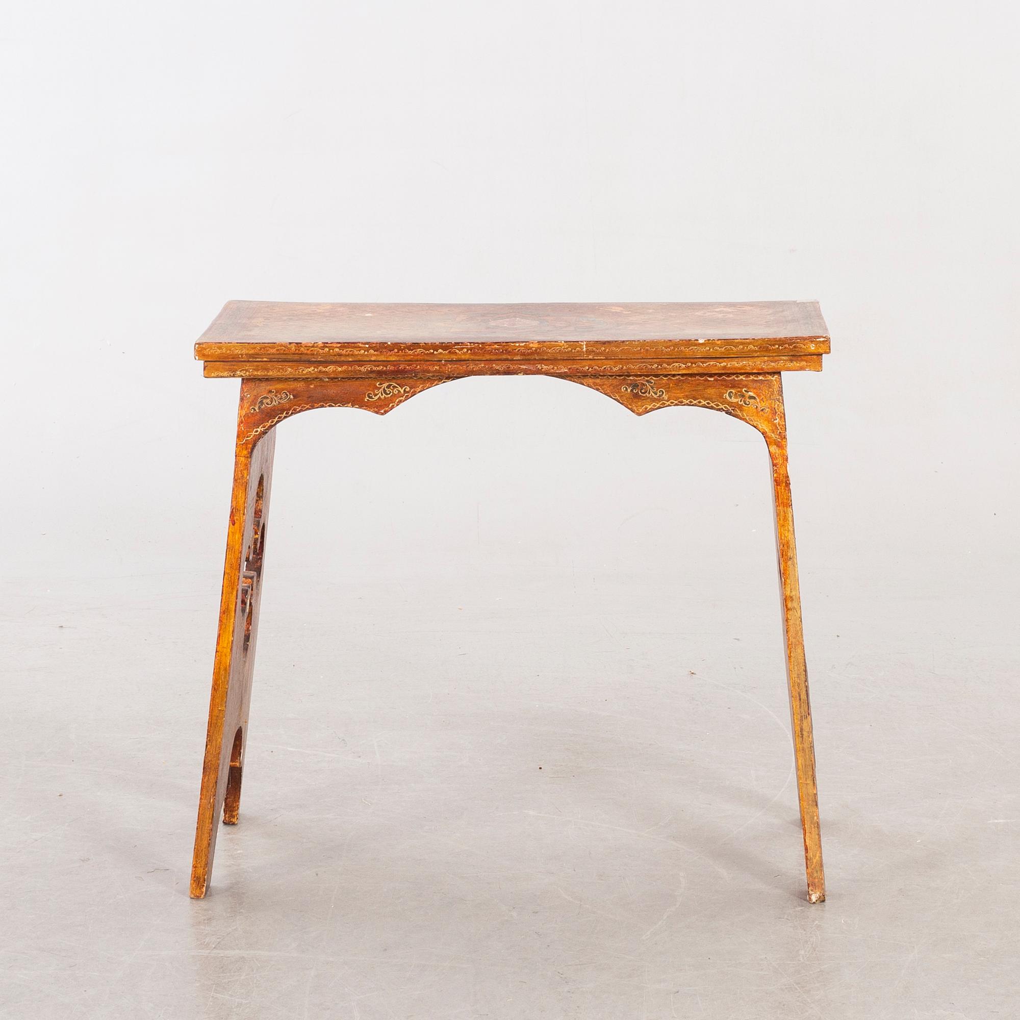 An mid 20th century wood table from Paoletti, Firenze Italy.
