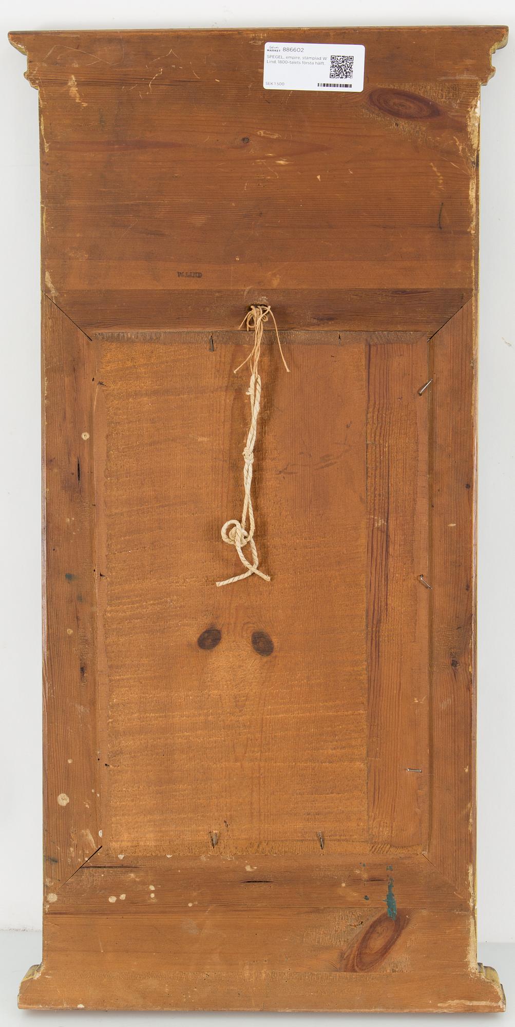 An Empire mirror marked W Lind, first half of the 19th century.