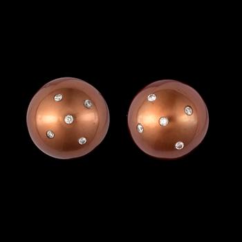 A pair of cultured brown south sea pearls set with brilliant-cut diamonds.