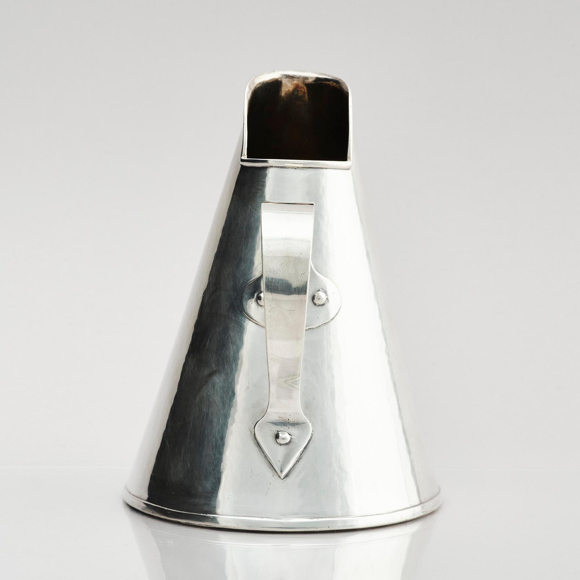 G H Markenius, a silver pitcher with handle, Stockholm 1957.