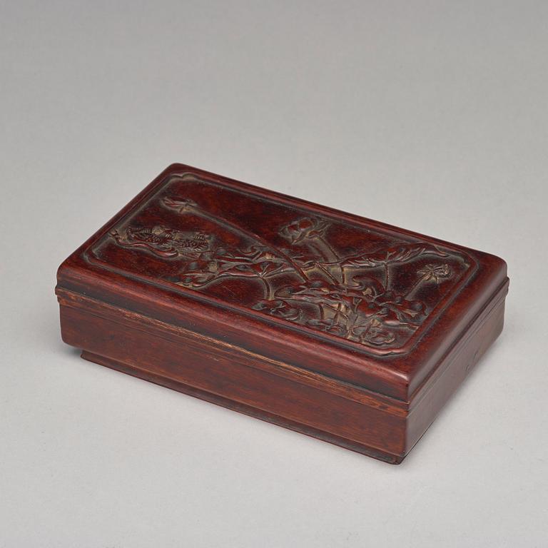 A Chinese wooden box, circa 1900.