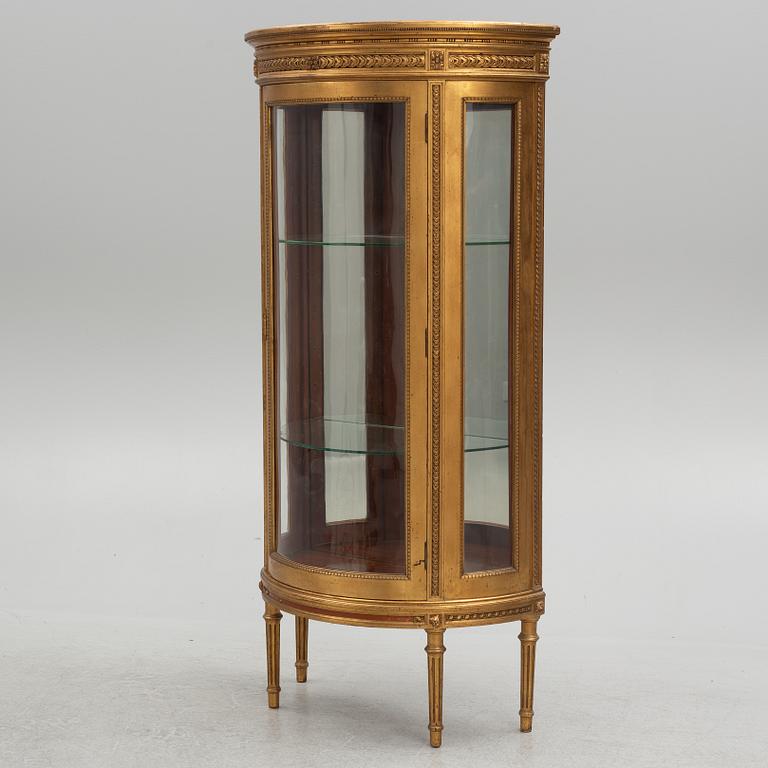 A Louis XVI-style display cabinet, circa 1900.